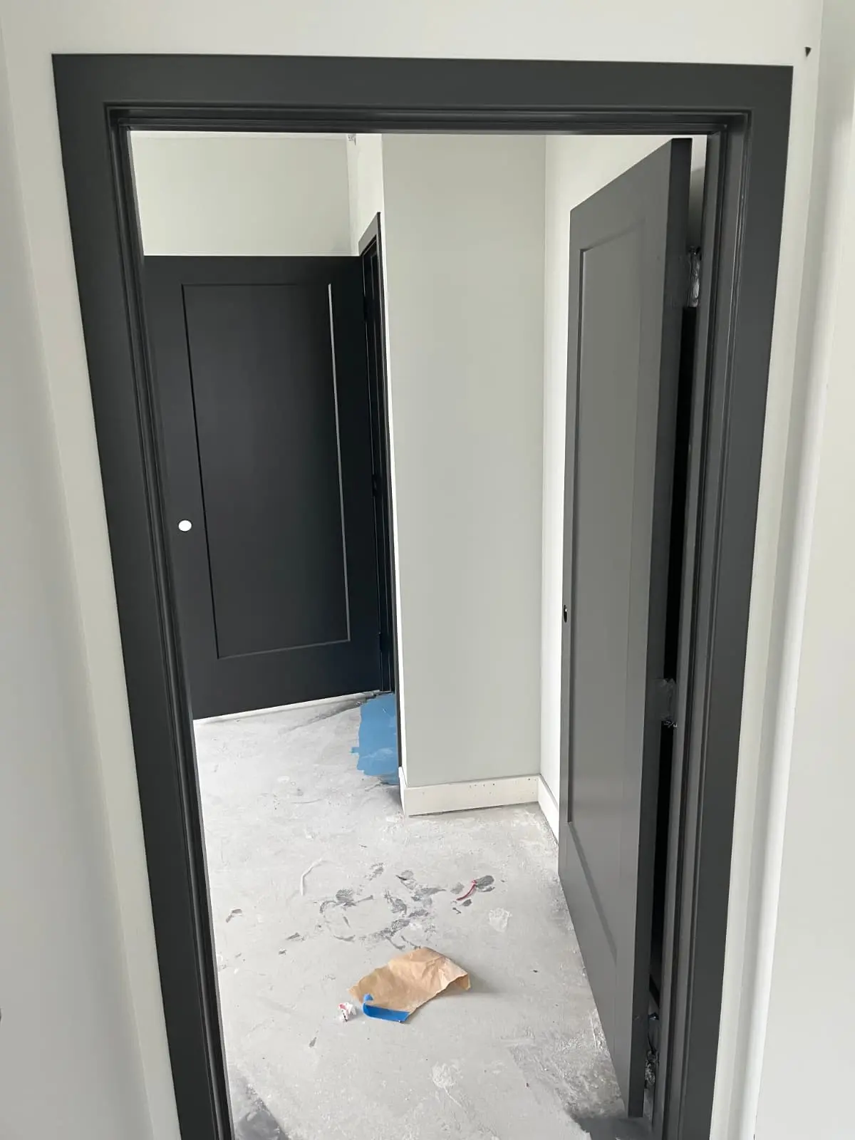 Commercial doorway and trim painted charcoal gray