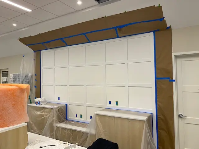 Commercial paneled wall protected during preparation