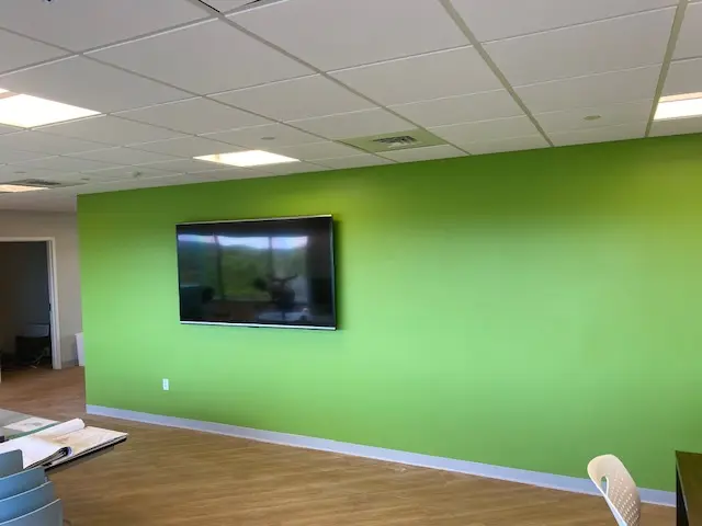 Commercial space with finished green feature wall