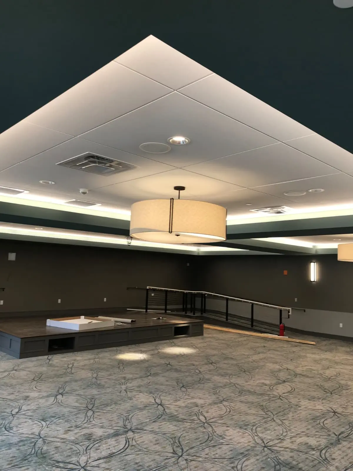 Modern commercial event room with dark painted details
