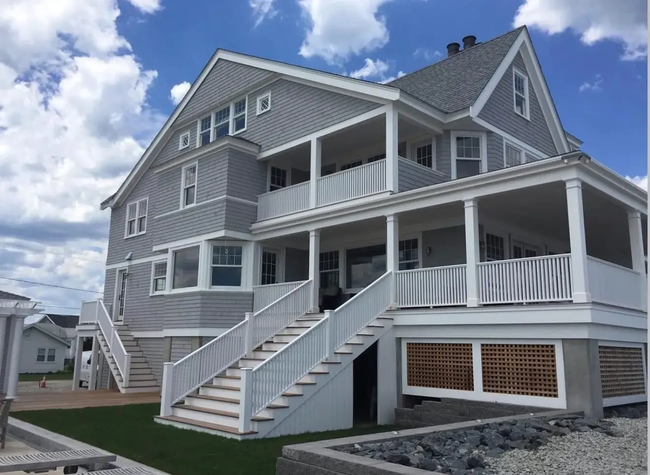 Completed gray and white coastal home exterior