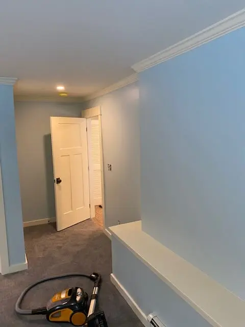 Light blue room with white ceiling and trim