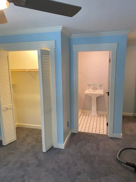 White trim and doors with freshly painted blue walls